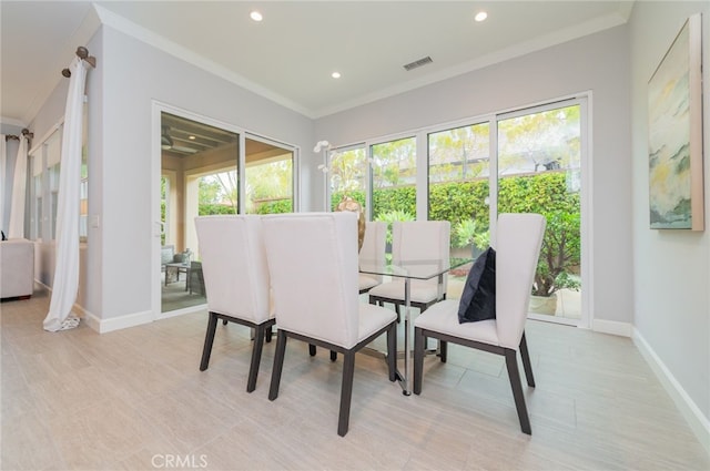 dining room featuring recessed lighting, visible vents, baseboards, and crown molding