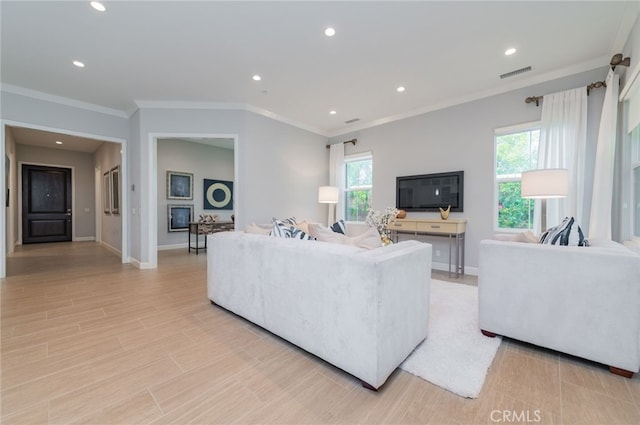 living room with recessed lighting, visible vents, baseboards, and ornamental molding