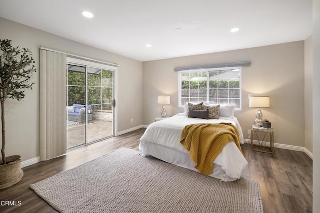 bedroom with access to exterior, wood finished floors, and baseboards