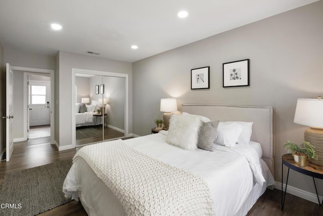 bedroom featuring recessed lighting, wood finished floors, a closet, and baseboards