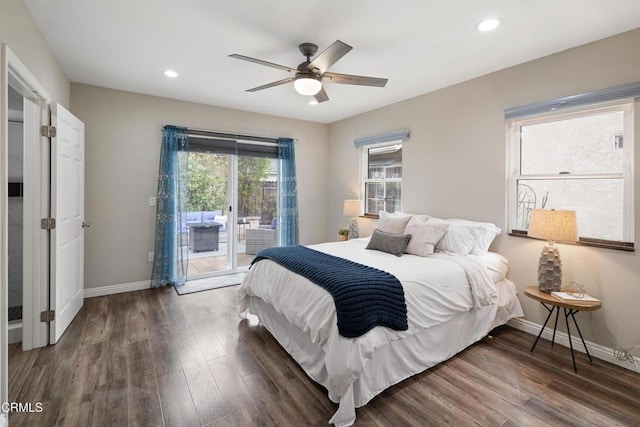 bedroom featuring access to exterior, baseboards, and wood finished floors