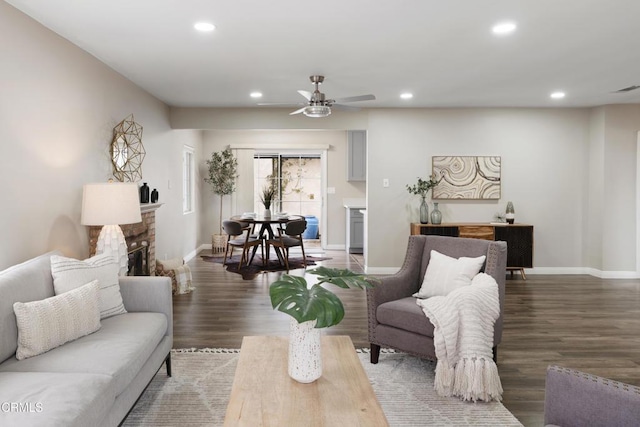 living area featuring recessed lighting, wood finished floors, and a ceiling fan