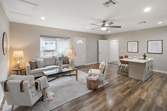 living area with visible vents, recessed lighting, ceiling fan, and dark wood-style flooring