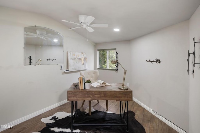 office space with vaulted ceiling, ceiling fan, baseboards, and wood finished floors