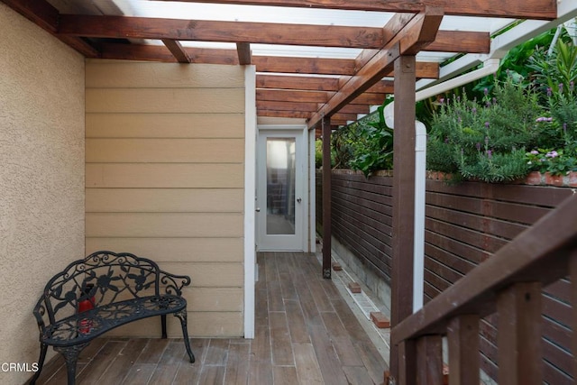 wooden deck featuring a pergola