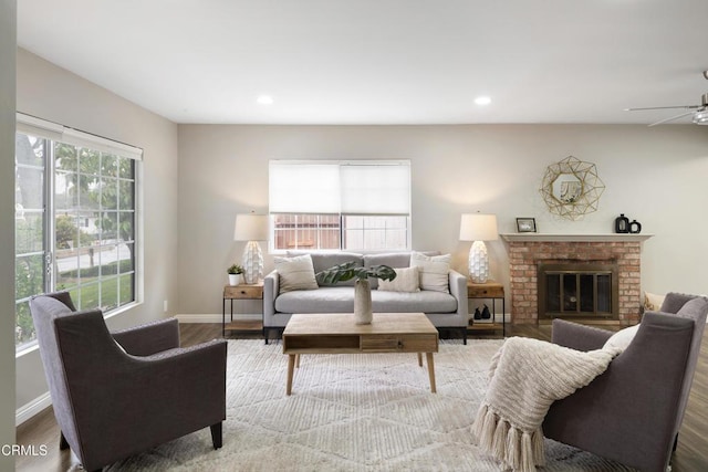 living area featuring recessed lighting, baseboards, a ceiling fan, and wood finished floors