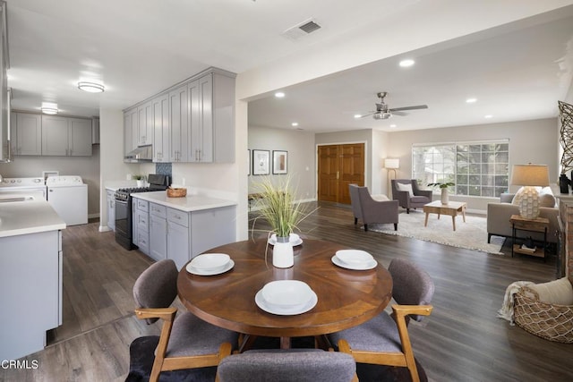 dining area featuring a ceiling fan, recessed lighting, separate washer and dryer, and dark wood-style flooring