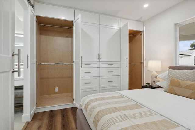 bedroom featuring recessed lighting, a closet, and dark wood-style floors