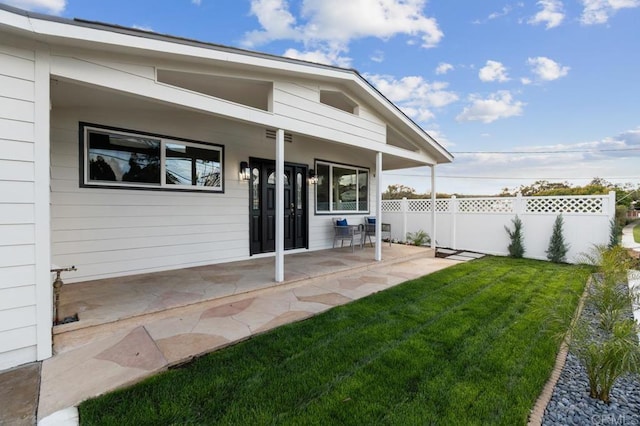 view of yard featuring a patio area and fence