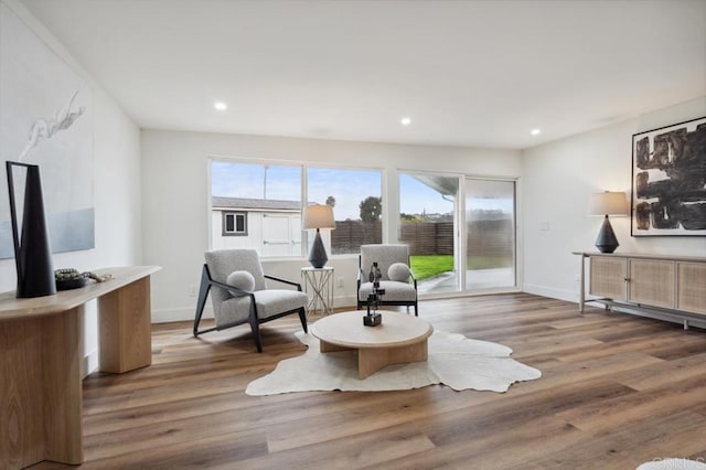 sitting room featuring recessed lighting, baseboards, and wood finished floors