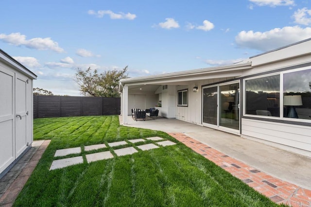 view of yard with a patio and a fenced backyard