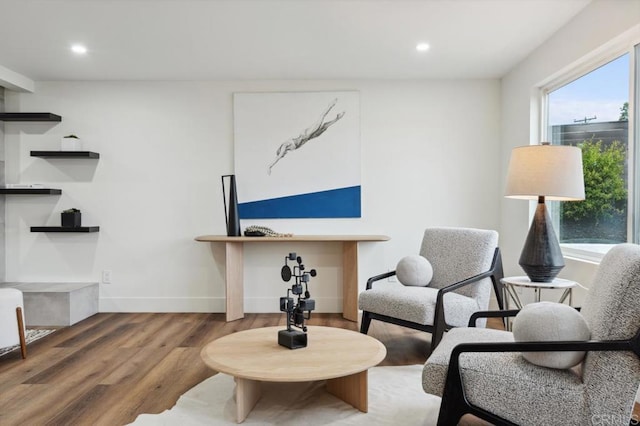 sitting room featuring recessed lighting, baseboards, and wood finished floors