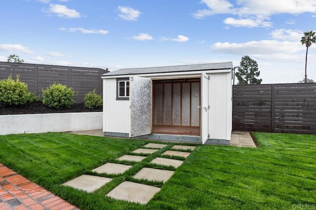 view of shed featuring a fenced backyard