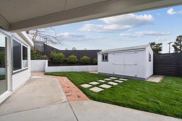 view of yard with a patio area, a fenced backyard, a storage shed, and an outdoor structure