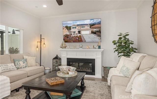 living area with a ceiling fan, crown molding, recessed lighting, and wood finished floors