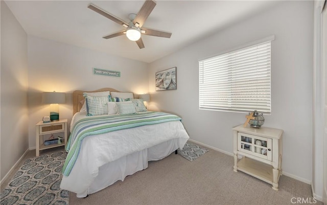 bedroom featuring baseboards, carpet floors, and ceiling fan