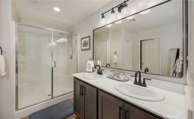 244 Country Club Dr, Calimesa, CA 92320 - bathroom with double vanity, a shower stall, and recessed lighting