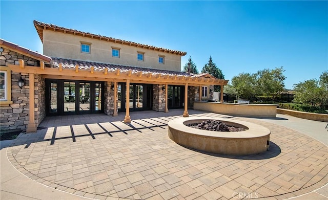 exterior space with an outdoor fire pit