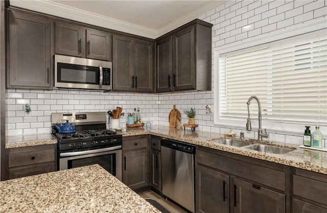 244 Country Club Dr, Calimesa, CA 92320 - kitchen featuring stainless steel appliances, a sink, dark brown cabinetry, ornamental molding, and backsplash