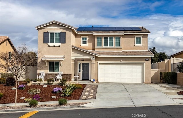 244 Country Club Dr, Calimesa, CA 92320 - traditional home featuring stucco siding, a garage, roof mounted solar panels, and concrete driveway