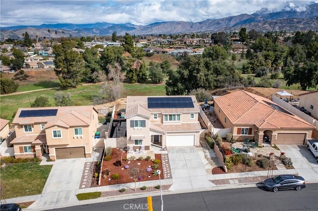 aerial view featuring a mountain view and a residential view