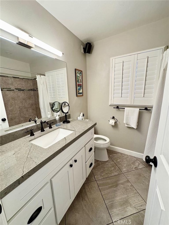 513 W Commonwealth Ave, Alhambra, CA 91801 - full bathroom with baseboards, toilet, tile patterned floors, vanity, and a shower with curtain