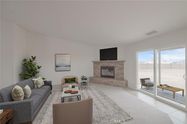 tiled living area with visible vents and a fireplace