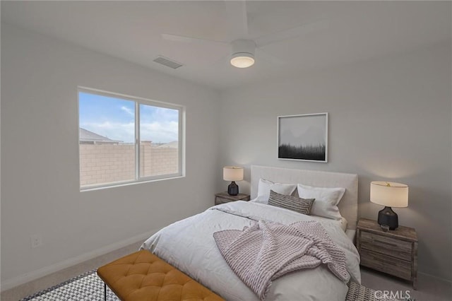 bedroom featuring baseboards, visible vents, carpet floors, and ceiling fan