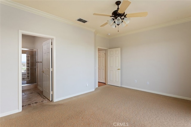 unfurnished bedroom with carpet flooring, baseboards, and visible vents