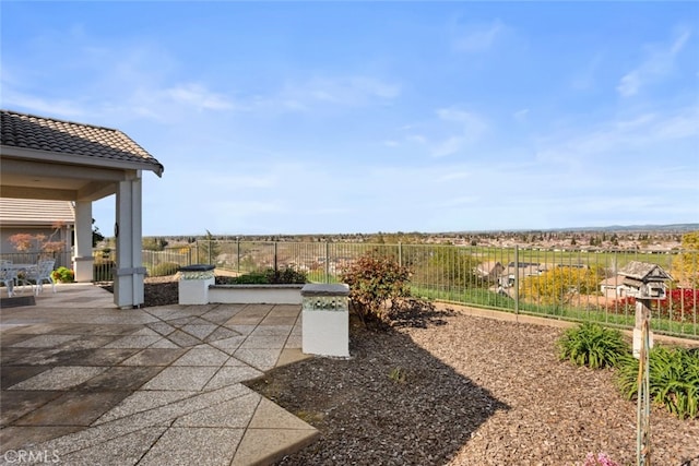 view of patio featuring fence