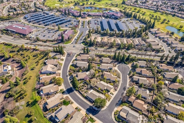 birds eye view of property featuring a residential view and a water view