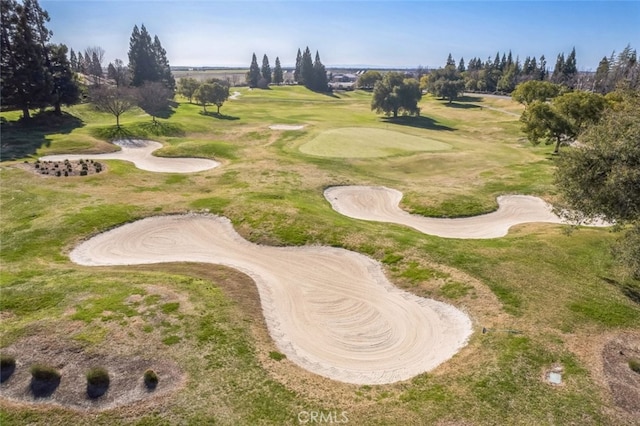 view of community featuring view of golf course