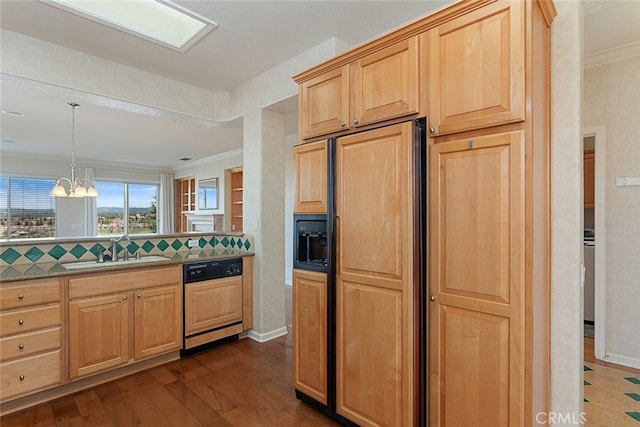 kitchen with light brown cabinets, paneled appliances, dark wood-type flooring, an inviting chandelier, and a sink