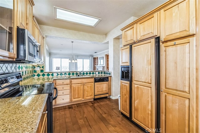 kitchen featuring light brown cabinets, paneled appliances, dark wood-type flooring, a peninsula, and a sink