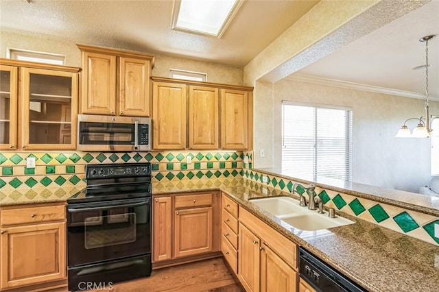 kitchen with light wood finished floors, electric range, a sink, dishwasher, and stainless steel microwave