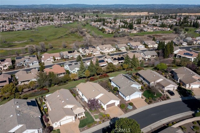 birds eye view of property with a residential view