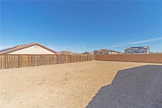 view of yard with a fenced backyard