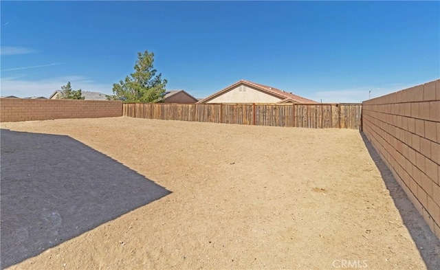 view of yard with a fenced backyard