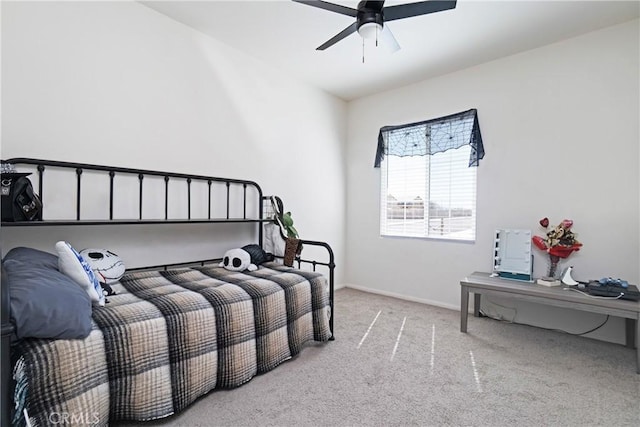 bedroom with baseboards, a ceiling fan, and carpet flooring