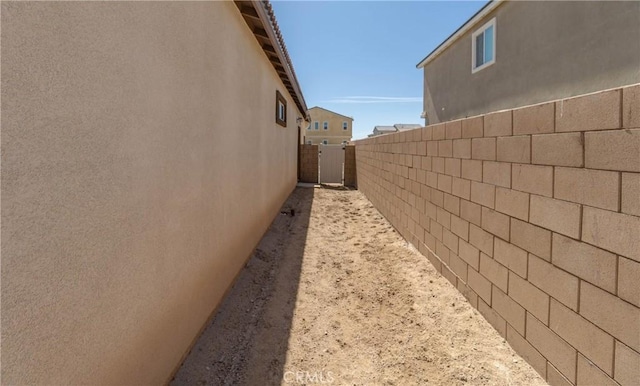 view of side of home with fence