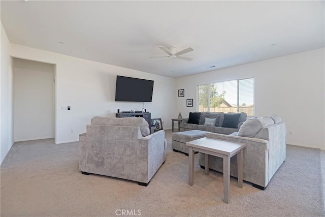 living room featuring light colored carpet and ceiling fan