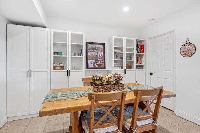 dining area featuring light tile patterned flooring, recessed lighting, and baseboards