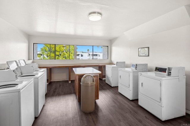 common laundry area with dark wood-style floors, a wealth of natural light, and washing machine and clothes dryer