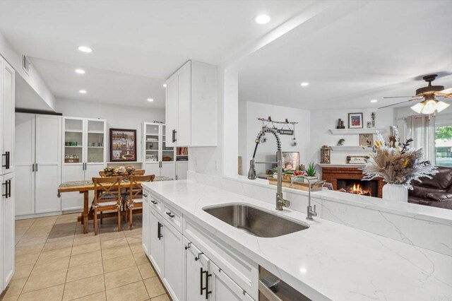 1020 E Washington Ave Unit 88, Escondido, CA 92025 - kitchen featuring light stone counters, recessed lighting, white cabinets, light tile patterned flooring, and a ceiling fan