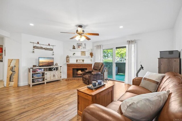 1020 E Washington Ave Unit 88, Escondido, CA 92025 - living room with ceiling fan, light wood-style floors, a fireplace, and recessed lighting