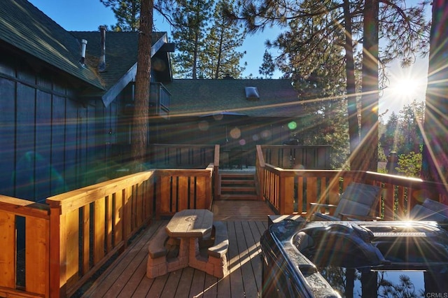 wooden deck featuring area for grilling