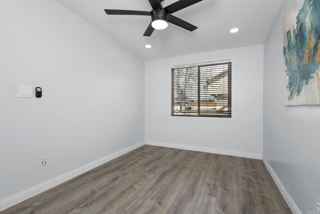 empty room featuring recessed lighting, baseboards, wood finished floors, and a ceiling fan