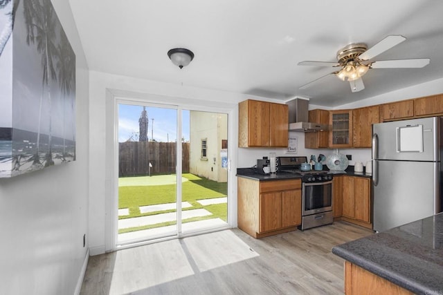 kitchen with dark countertops, brown cabinets, and appliances with stainless steel finishes