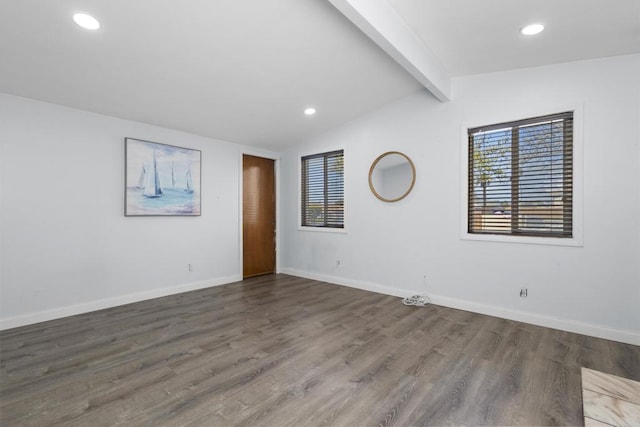 unfurnished room featuring lofted ceiling with beams, baseboards, wood finished floors, and recessed lighting