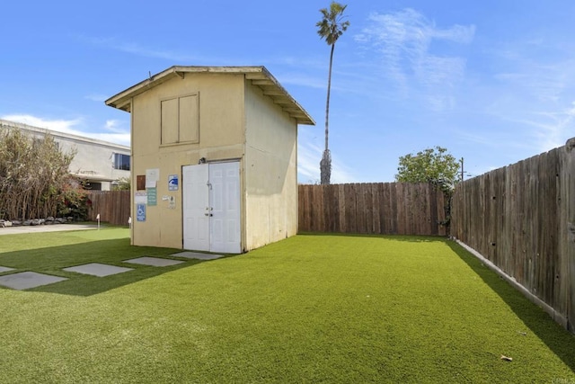 view of outbuilding with an outbuilding and a fenced backyard